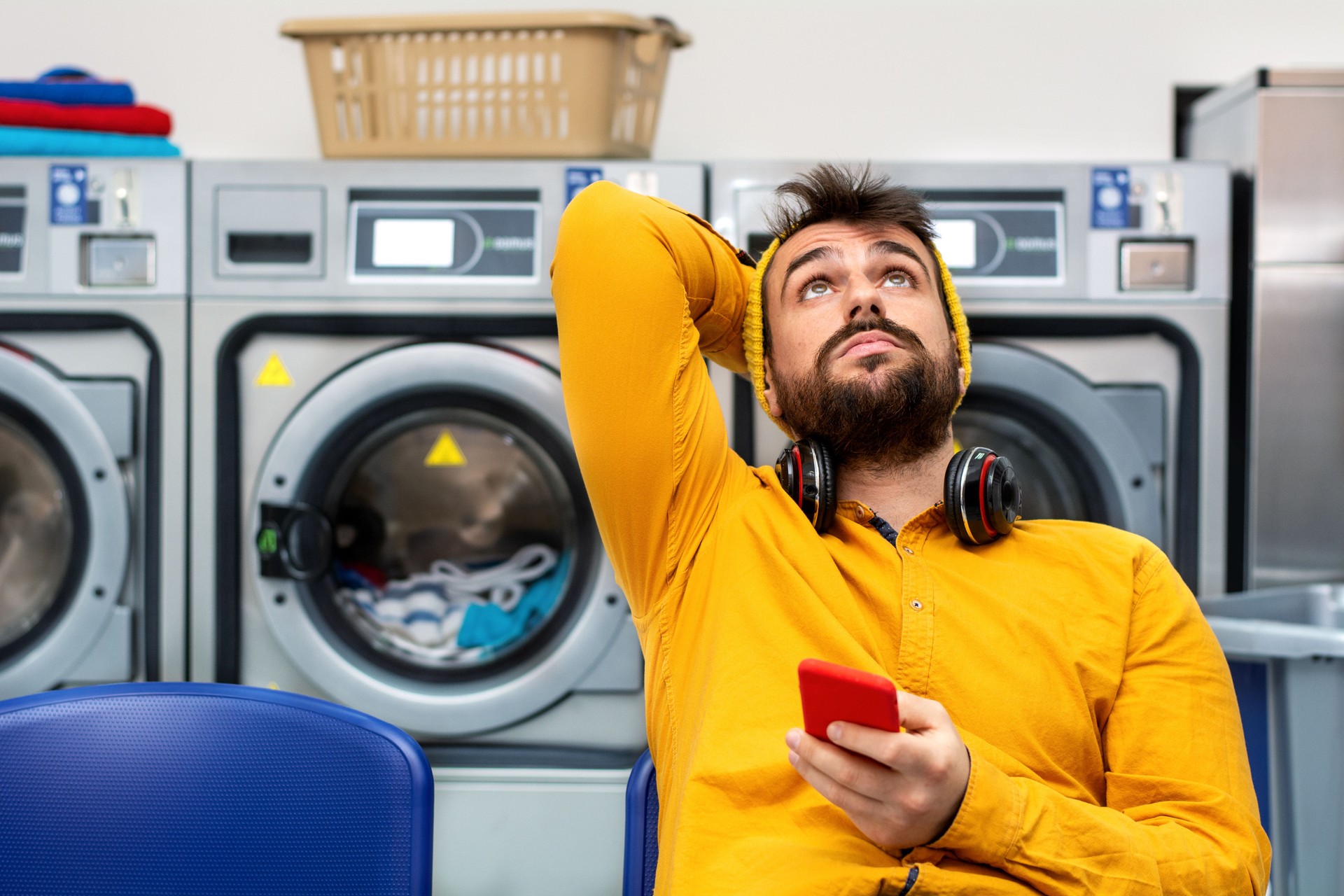 Young man washing his clothes